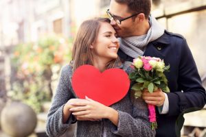 Couple smiling with heart